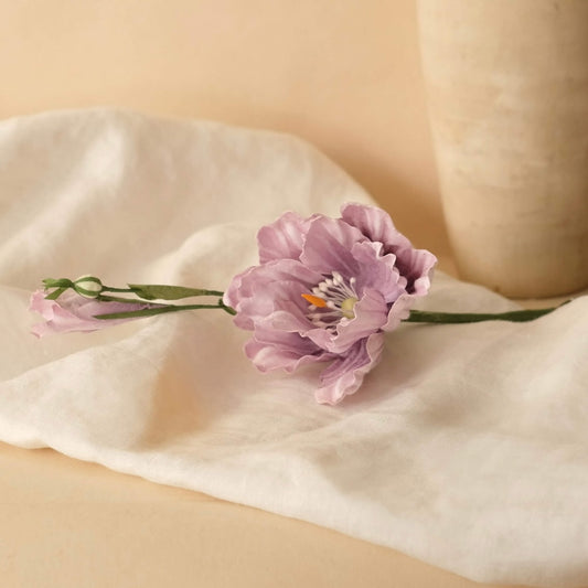 Lisianthus in purple paper